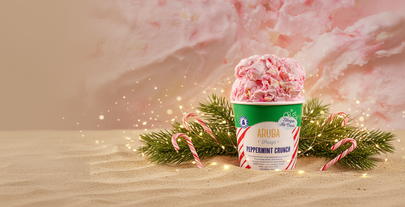 Ice cream container with pink peppermint crunch ice cream on a festive background with candy canes and lights.